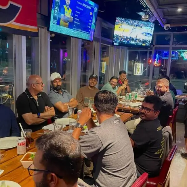 guys talking and enjoying delicious indian cuisines only at masala lounge and grill